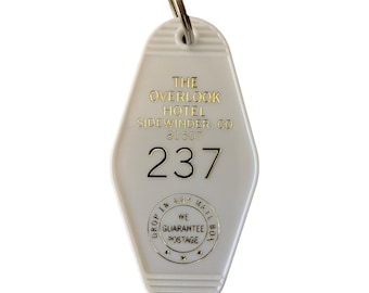 The white block letter and gold shining inspired Overlook Hotel key tag