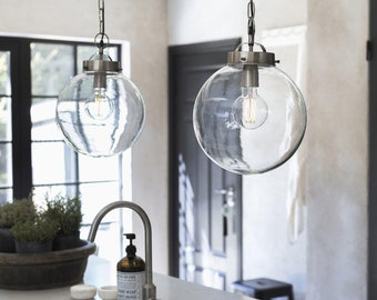 Hanging lamp made of glass in a spherical shape