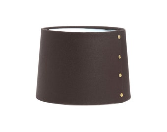 Leather look lampshade with gold rivets