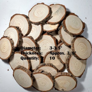 May include: A pile of 10 natural wood slices, each with a diameter of 3-3.5 inches and a thickness of approximately 3/8 inch. The wood slices are light brown with visible grain patterns.