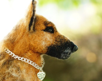 May include: A brown and black German Shepherd dog made of felt, wearing a silver chain collar with a heart-shaped tag that reads "Made with Love".