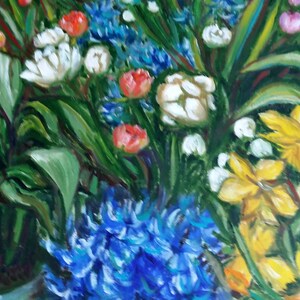 May include: A painting of a bouquet of flowers in a vase. The flowers are white, yellow, blue, and red. The background is a blurry green.