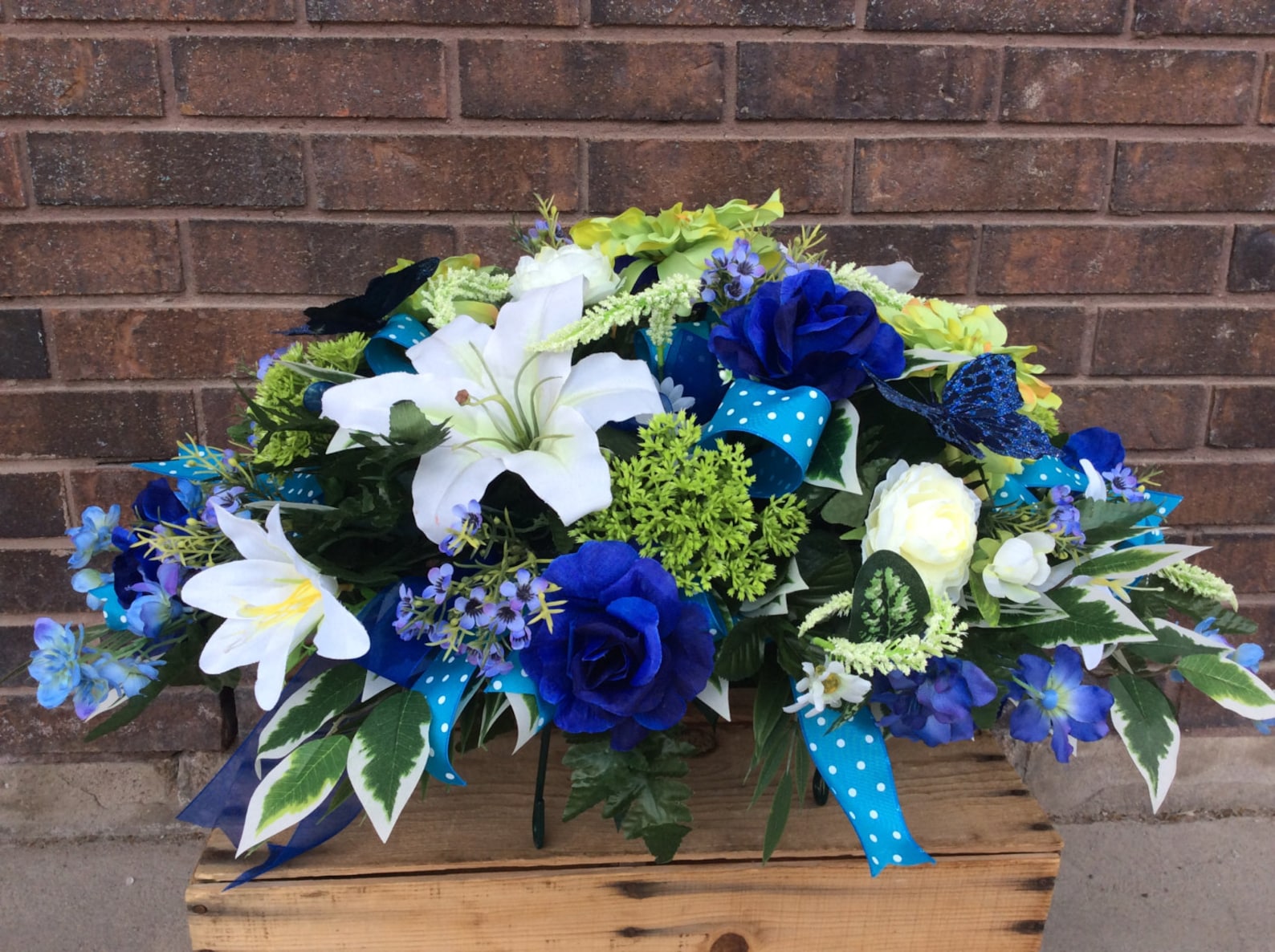 Floral Tributes For Eternal Rest: Saddle Flowers For Headstones