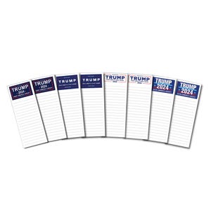 May include: Eight white notepad memo pads with blue and red text that reads "TRUMP 2024" and "SAVE AMERICA AGAIN".