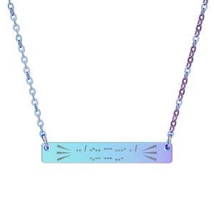 May include: A gradient-colored necklace with a bar pendant and chain. The bar pendant has a series of dots and dashes, and two sets of three lines on each side. The chain and pendant have a blue to purple color gradient.