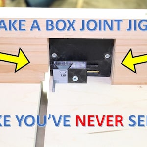 May include: Image of a box joint jig with the text "MAKE A BOX JOINT JIG LIKE YOU'VE NEVER SEEN". The jig is made of wood and black plastic, with yellow arrows pointing to the sides. A 1/8 inch measurement is visible.