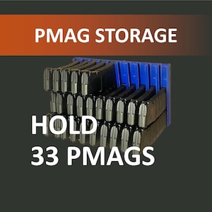 May include: A blue plastic storage rack designed to hold multiple black magazines, featuring a grid-like structure. The image includes the white text PMAG STORAGE and HOLD 33 PMAGS, indicating the capacity of the organizer for firearm accessories.