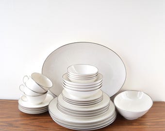 Set of 30-piece Noritake Montblanc 7527 Dinnerware with Silver Trim 4 Place setting Table