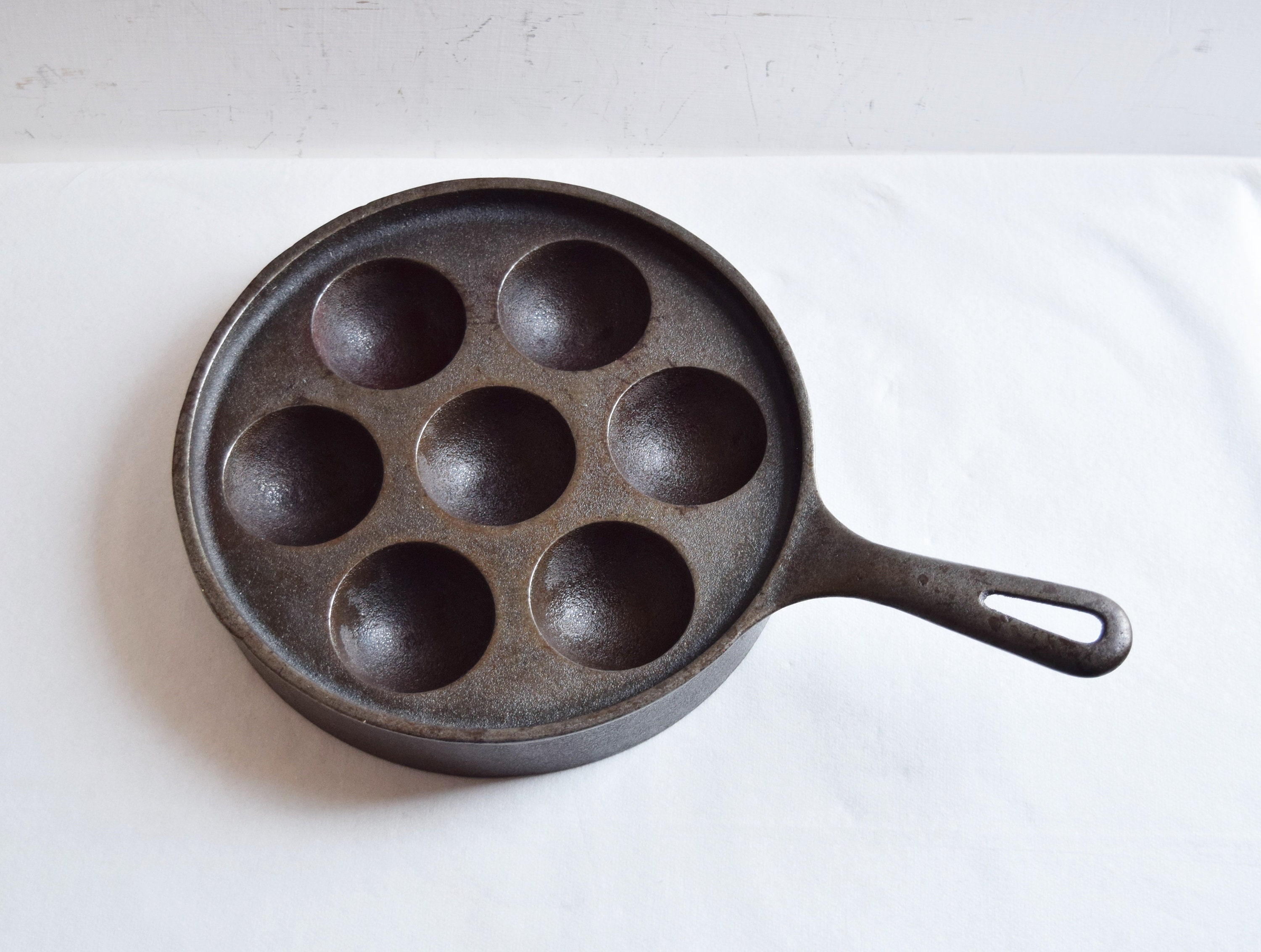 Aebleskiver pan being used. Griswold cast iron. Induction stovetop