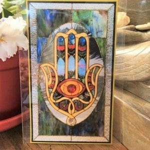 Hamsa-sticker, met de hand verfraaid.