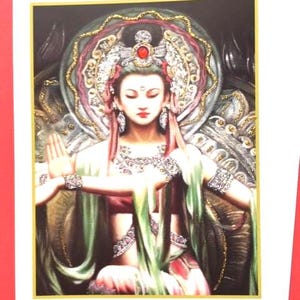 May include: A colorful illustration of a female deity with a crown and ornate jewelry, sitting on a throne with a green and gold background.