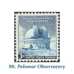 May include: A blue and white United States postage stamp featuring a drawing of the Palomar Mountain Observatory, with the text "Palomar Mountain Observatory" and "3¢ United States Postage" printed on the stamp.