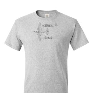 May include: Ash grey t-shirt featuring a black line drawing of an airplane. The design includes top, side, and front views of the aircraft. The text "Ash Grey" is printed at the bottom of the shirt.