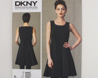 May include: DKNY Donna Karan New York Vogue Patterns American Designer sewing pattern for a sleeveless black dress with a round neckline. The pattern number is V1408.