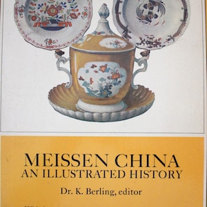 May include: A book cover featuring a yellow background with the title "Meissen China: An Illustrated History" in black text. The cover also features a yellow and white porcelain tea set with floral designs.