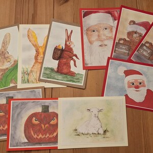 Conjunto de 4 cartões, cada um com o mesmo motivo para Páscoa, Halloween ou Natal