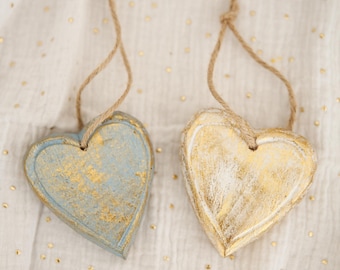 Green and gold wooden heart decoration to hang, with natural fiber rope, handmade in Bali.