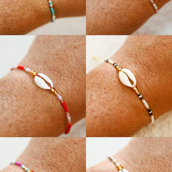Adjustable Bali cowrie bracelet with shells and colorful beads. Available in several colors: pink, red, blue, gray, black, and white.