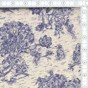 May include: Cream-colored fabric with a blue toile pattern. The design features pastoral scenes with figures, trees, houses, and other elements. The fabric is likely cotton or a similar material, suitable for various sewing projects.