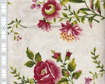 May include: A white fabric with a floral pattern featuring pink, red, and green flowers. The flowers are arranged in a repeating pattern on the fabric.