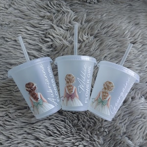 May include: Three clear plastic tumblers with lids and straws. Each tumbler features a graphic of a girl in a white dress with a bow. The text on the tumblers reads "Aubrianna Flower Girl", "Millie Flower Girl", and "Georgina Flower Girl".