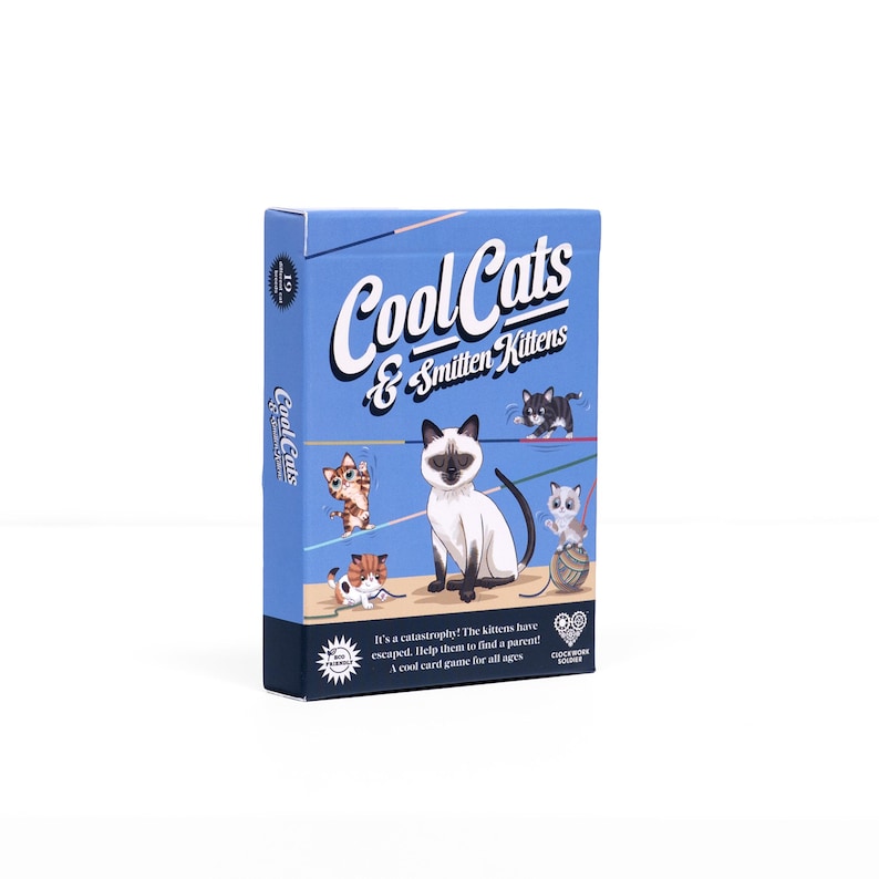May include: A blue card game box titled "Cool Cats & Smitten Kittens" with illustrations of various cartoon cats. The box includes the text "It's a catastrophe! The kittens have escaped. Help them to find a parent! A cool card game for all ages."