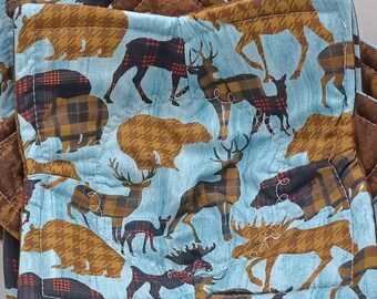May include: Set of four blue and brown quilted pot holders with a woodland animal print. The print features bears, deer, moose, and plaid patterns.