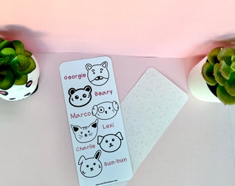 May include: A white card with black and white illustrations of animal faces and names. The names are Georgie, Beary, Marco, Lexi, Charlie, and Bun-bun. The card has a pink background and the text "www.prettydream.co.uk" at the bottom.
