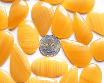 Lote de cabujones al por mayor de aragonita amarilla por peso con diferentes formas y tamaños utilizados para la fabricación de joyas