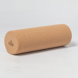 May include: A brown cork yoga roller with the word "Bllo" printed on the side.