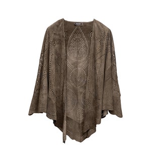 May include: A brown suede cardigan with a cut-out design. The cardigan has a V-neck and long sleeves.