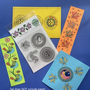 May include: A set of Madhubani stamping kit with four rubber stamps, including a fish, a bird, a mandala, and a floral design. The stamps are on a white background. The set does not include paper, pens, colors, paints, and other accessories.
