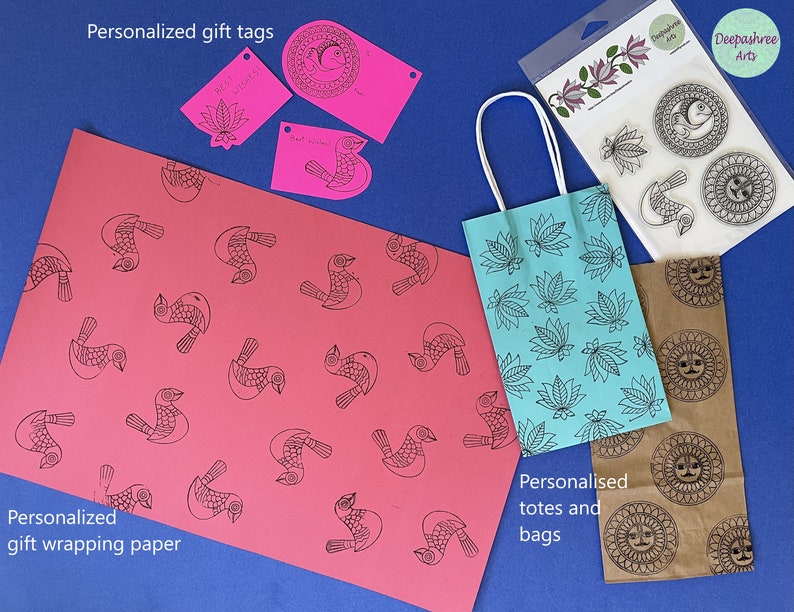 May include: A set of personalized gift tags, totes, and bags featuring a bird and sun design. The tags are pink and white, the tote is blue, and the bag is brown.