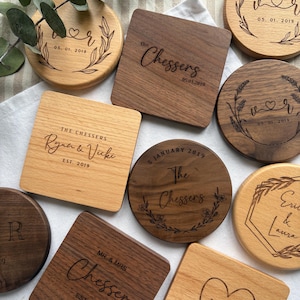 May include: A collection of personalised wooden coasters with various designs and text, including names, dates, and the words "The Chessers".