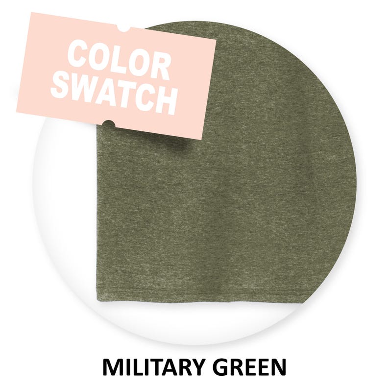 May include: A close-up of a fabric swatch in military green. The swatch is circular and has a textured surface.