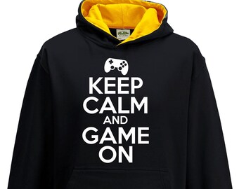 Gaming Hoodie “Keep Calm And Game On” | Retro Gaming Kapuzen Sweatshirt für Reisen, College, Festival | Geschenk für Gamer Freunde, Papa