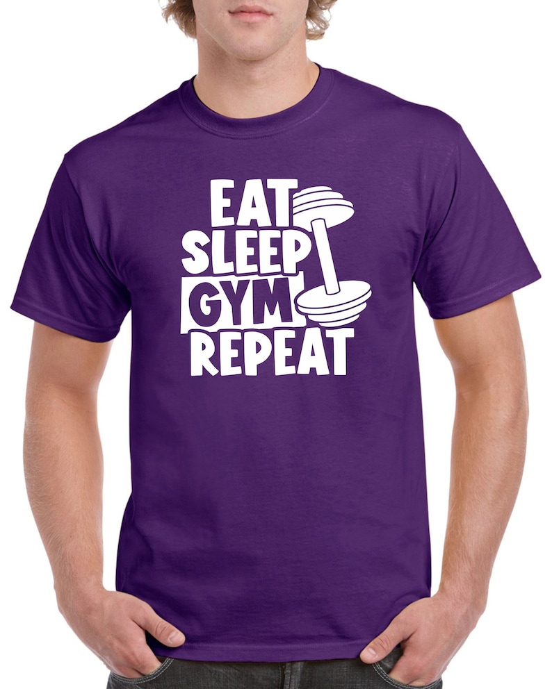 May include: Purple t-shirt with white text that reads "Eat Sleep Gym Repeat" and a white dumbbell graphic.