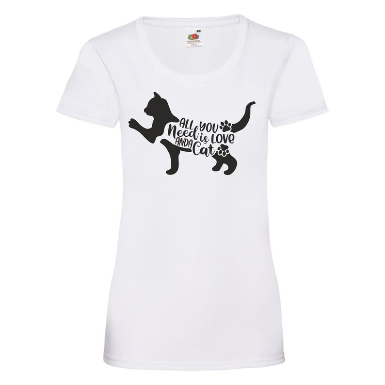 May include: White t-shirt with a black cat silhouette and the text "All you need is love and a cat" printed on the front.