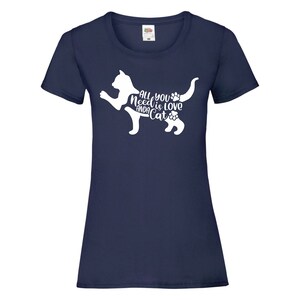 May include: A navy blue t-shirt with a white silhouette of a cat and the text "All you need is love and a cat".
