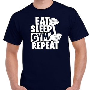 May include: A navy blue t-shirt with white text that reads "Eat Sleep Gym Repeat" and a white dumbbell graphic.