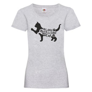 May include: Gray t-shirt with a black silhouette of a cat and the text "All you need is love and a cat" printed on the front.