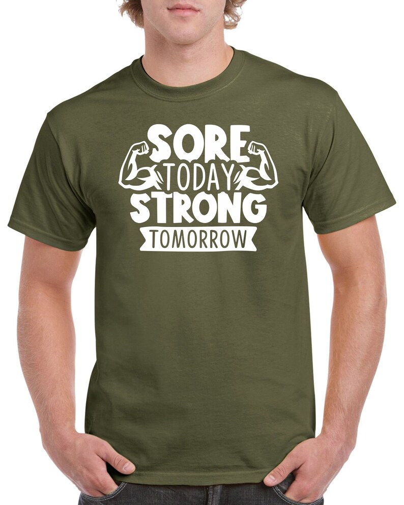 May include: A green t-shirt with white text that reads "Sore Today Strong Tomorrow" with a graphic of two bicep muscles.
