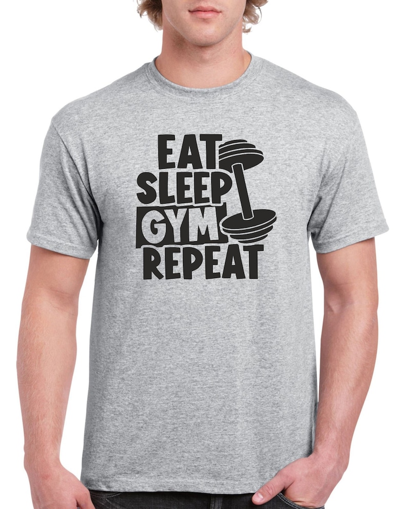 May include: Gray t-shirt with a black graphic that says "Eat Sleep Gym Repeat" with a dumbbell graphic.