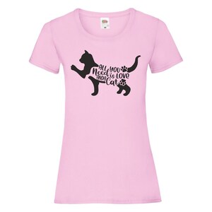 May include: Pink women's t-shirt with a black silhouette of a cat and the text "All you need is love and a cat".