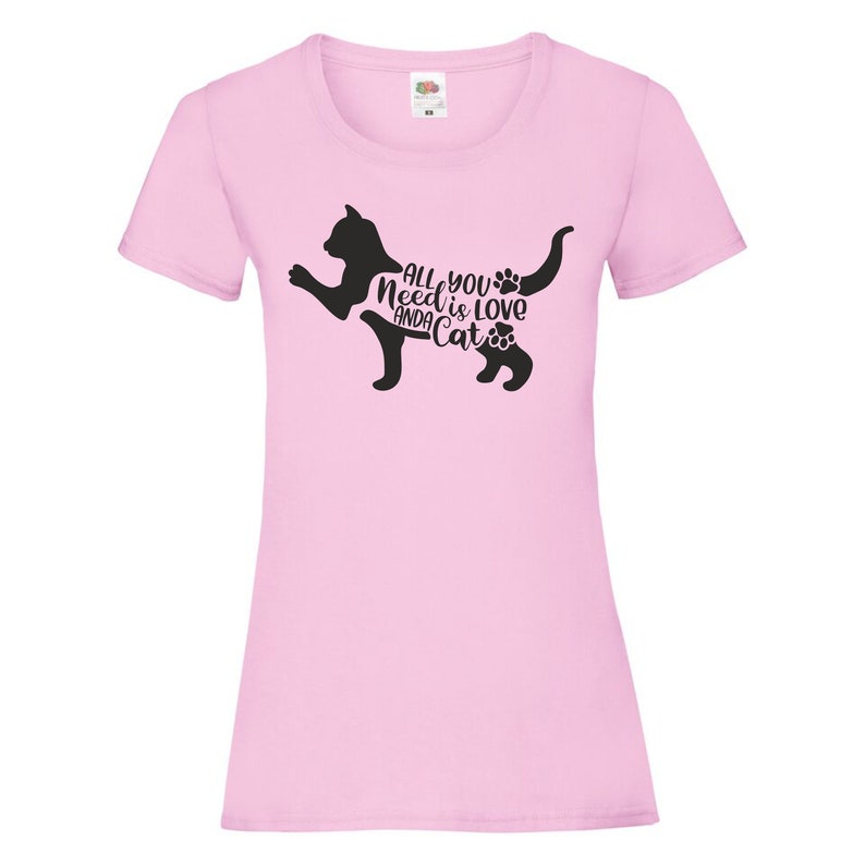 May include: Pink women's t-shirt with a black silhouette of a cat and the text "All you need is love and a cat".