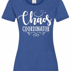 May include: A royal blue t-shirt with a white graphic that says "Chaos Coordinator" with a decorative flourish.