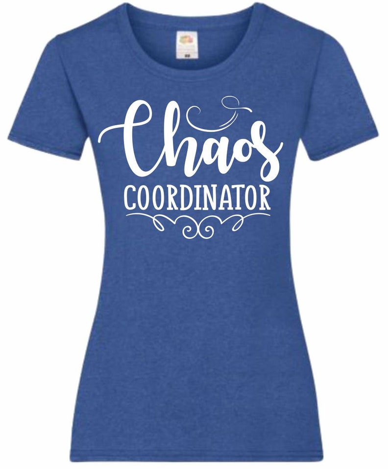 May include: A royal blue t-shirt with a white graphic that says "Chaos Coordinator" with a decorative flourish.