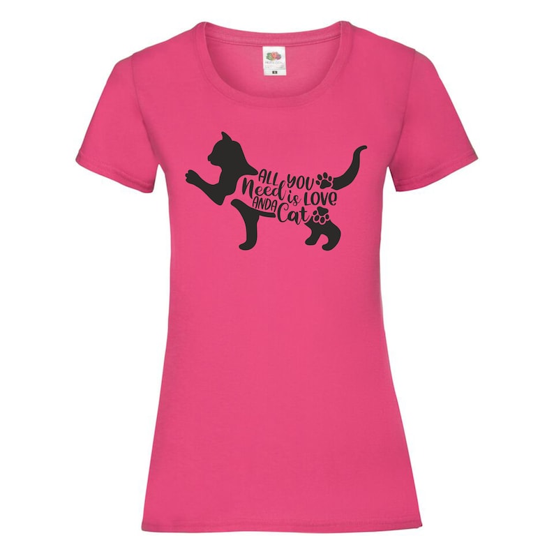 May include: Pink women's t-shirt with a black silhouette of a cat and the text "All you need is love and a cat".