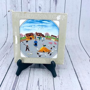 May include: A set of three ceramic mugs with a speckled, matte finish. The mugs are in cream, light grey, and dark grey. Each mug has a simple, minimalist design, ideal for coffee or tea.