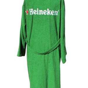 May include: Green bathrobe with a white and red Heineken logo on the back.